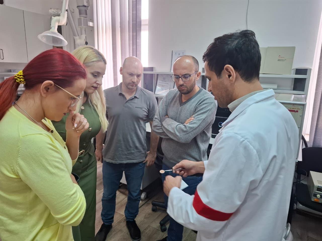 AGU team and SETM representatives discussing laboratory equipment in Baku