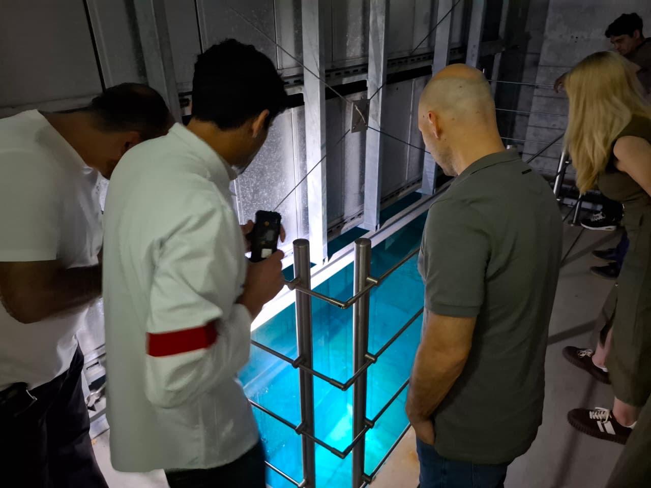 Researchers inspecting measurement equipment during the Baku collaboration visit